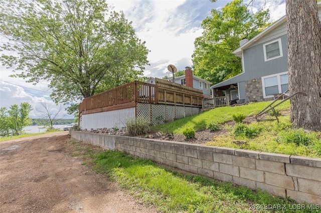 view of property exterior featuring a deck