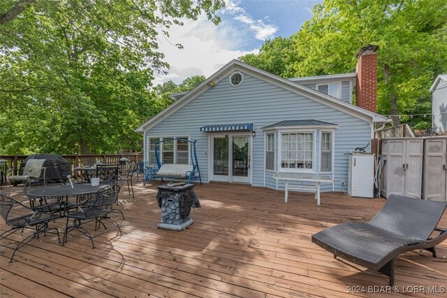 wooden deck featuring grilling area