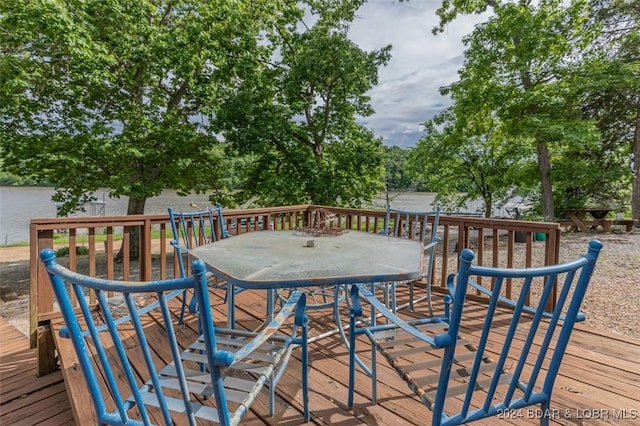 wooden deck featuring outdoor dining area