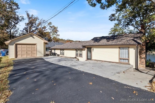 ranch-style home with an outbuilding