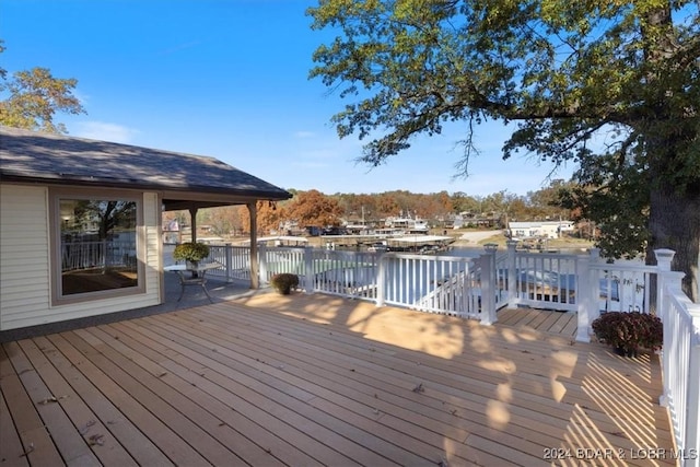 wooden terrace with a water view