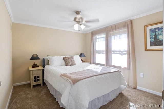 carpeted bedroom featuring ceiling fan and crown molding