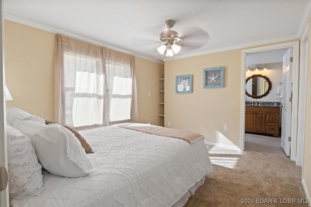 bedroom featuring connected bathroom, light colored carpet, ceiling fan, and ornamental molding