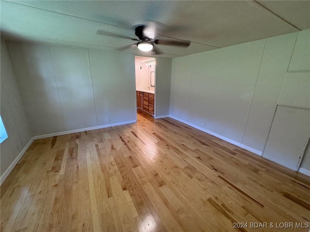 unfurnished room featuring ceiling fan and light hardwood / wood-style floors