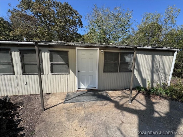 entrance to property with a patio area