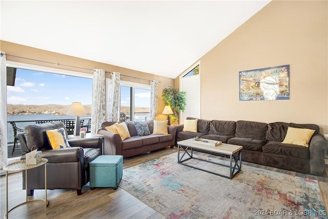 living room with high vaulted ceiling and wood-type flooring