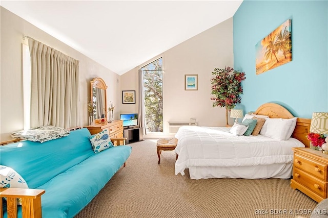 bedroom with vaulted ceiling, access to exterior, and carpet floors