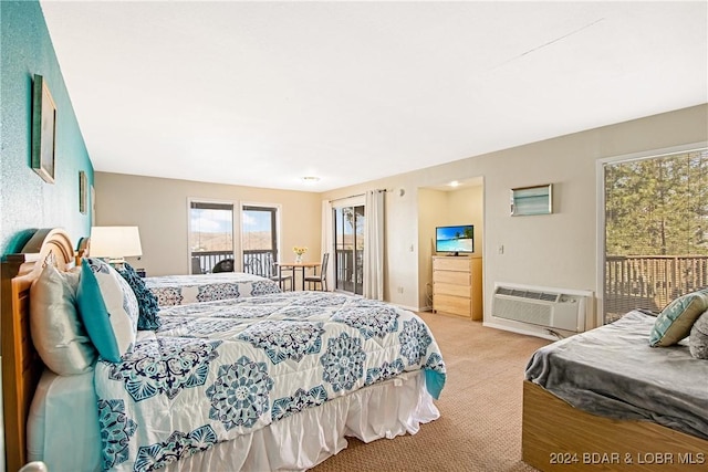 bedroom featuring carpet, an AC wall unit, and access to outside