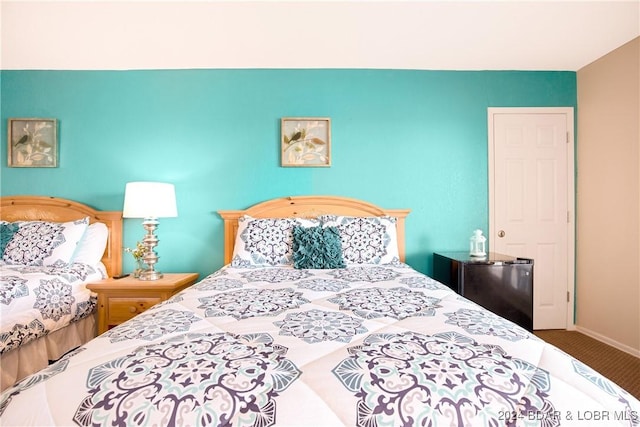 bedroom featuring baseboards