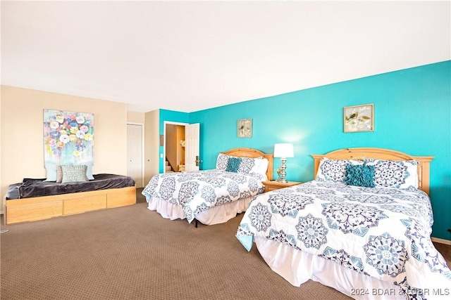 bedroom with carpet floors and a closet