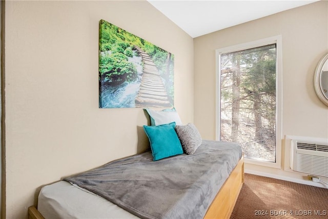 carpeted bedroom with an AC wall unit