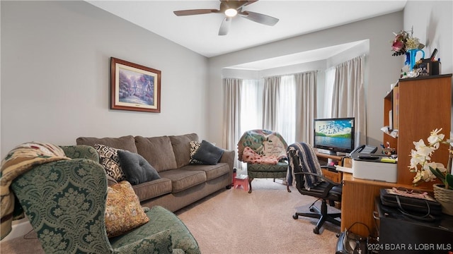 carpeted office space with ceiling fan