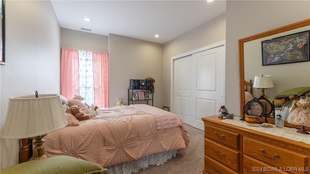 carpeted bedroom featuring a closet