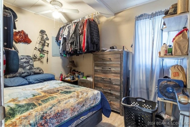 bedroom featuring ceiling fan and light hardwood / wood-style floors