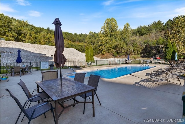 view of swimming pool featuring a patio