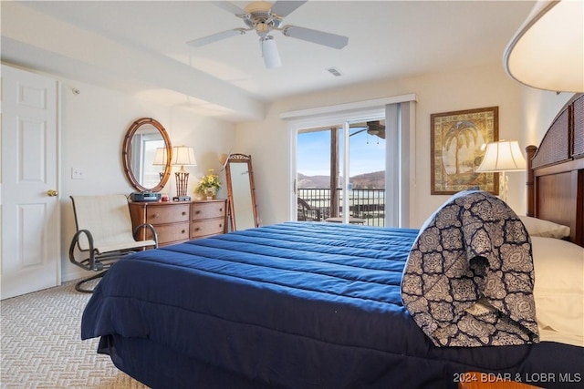 bedroom featuring access to exterior, ceiling fan, and light colored carpet