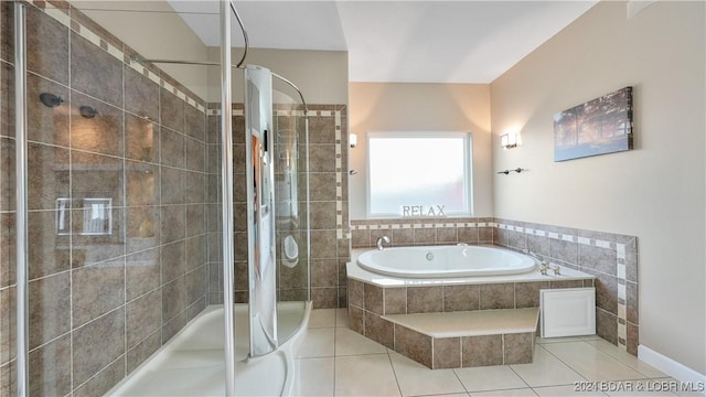 bathroom featuring tile patterned flooring and plus walk in shower