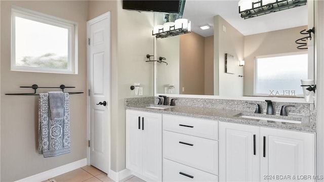 bathroom with tile patterned flooring and vanity