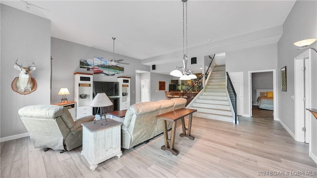 living room featuring ceiling fan and light wood-type flooring