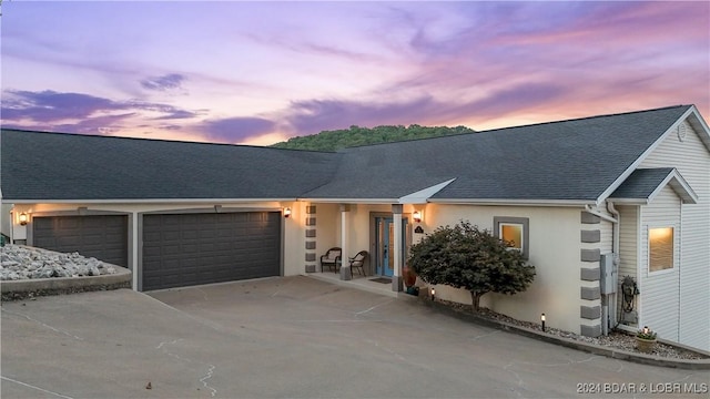 single story home with a garage