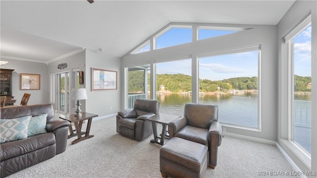 living room featuring carpet, a water view, a wealth of natural light, and lofted ceiling