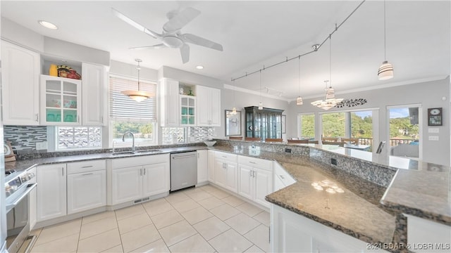 kitchen featuring white cabinetry, sink, pendant lighting, and appliances with stainless steel finishes