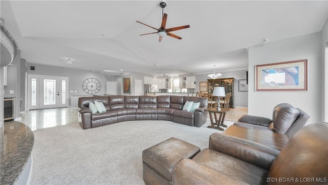 living room with ceiling fan, light carpet, and high vaulted ceiling