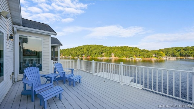 wooden deck featuring a water view