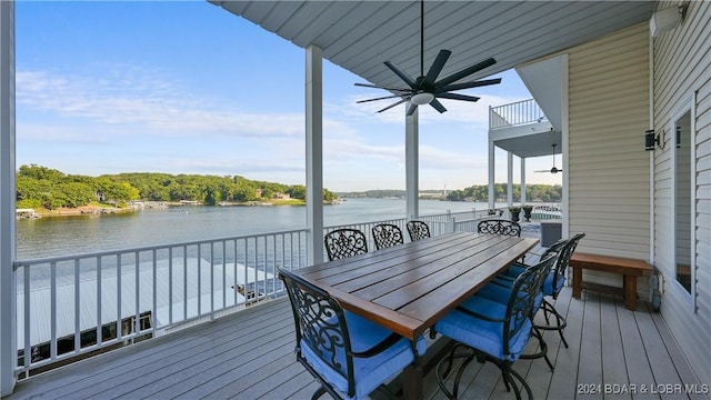 deck featuring a water view and ceiling fan