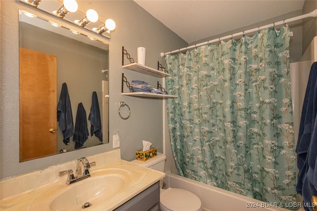 full bathroom with vanity, toilet, and shower / bath combo with shower curtain