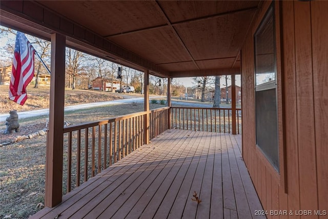 wooden terrace with a porch