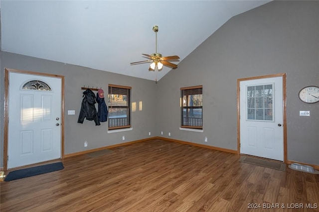 entryway featuring hardwood / wood-style floors, high vaulted ceiling, and ceiling fan