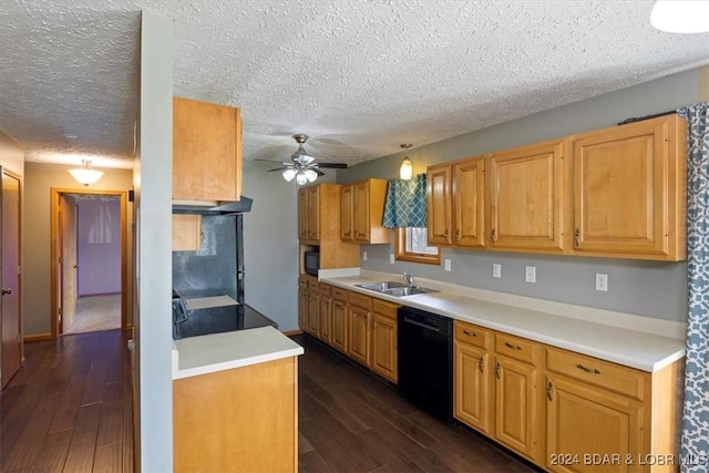 kitchen featuring black appliances, sink, dark wood-type flooring, and a textured ceiling