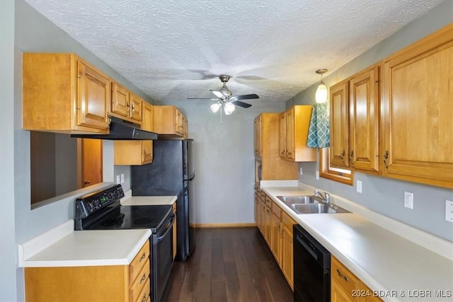 kitchen featuring dark hardwood / wood-style flooring, ceiling fan, sink, black appliances, and pendant lighting