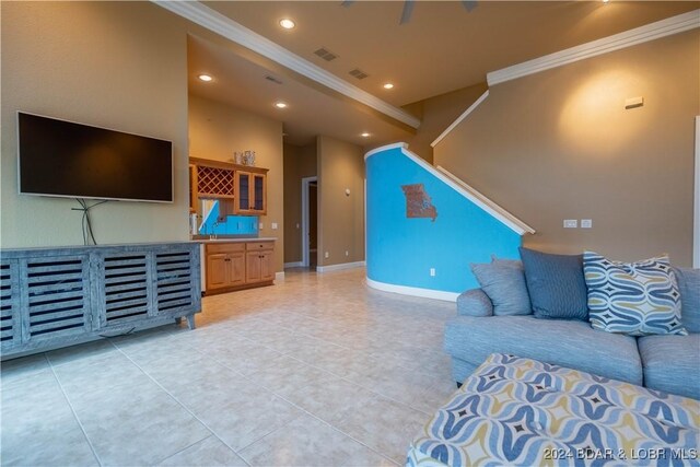 825 Grand View Dr, Porto Cima, MO 65079 - living room featuring crown molding, recessed lighting, and light tile patterned flooring