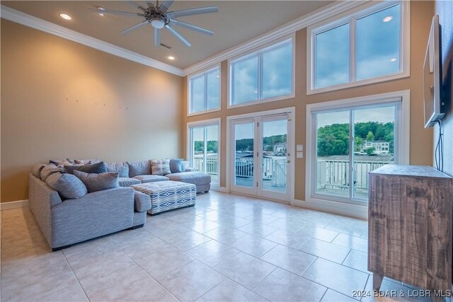 825 Grand View Dr, Porto Cima, MO 65079 - living room with crown molding, a ceiling fan, light tile patterned floors, a towering ceiling, and recessed lighting