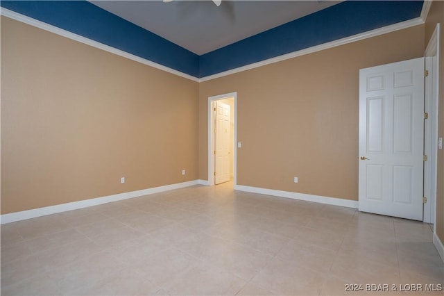 tiled empty room with crown molding