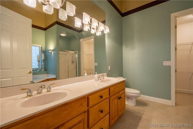 825 Grand View Dr, Porto Cima, MO 65079 - bathroom featuring a shower stall, a spacious closet, double vanity, tile patterned floors, and a bath