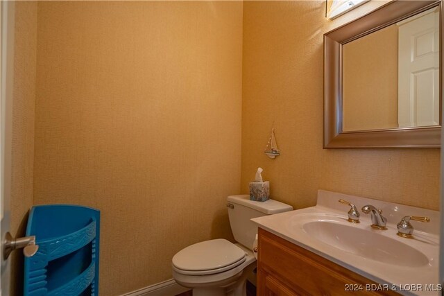 825 Grand View Dr, Porto Cima, MO 65079 - half bath featuring toilet and vanity