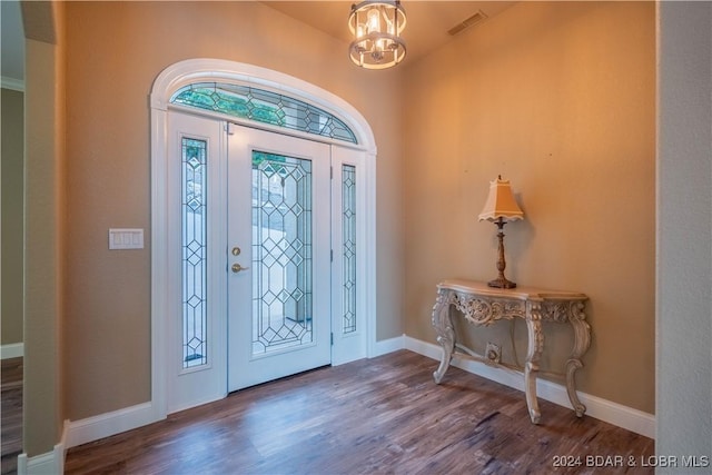 825 Grand View Dr, Porto Cima, MO 65079 - foyer entrance featuring wood finished floors and a chandelier