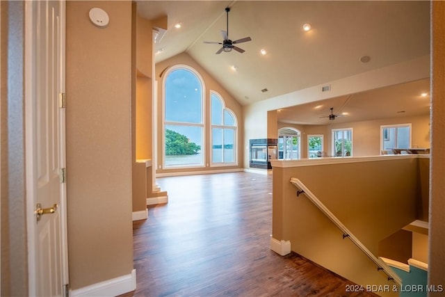 825 Grand View Dr, Porto Cima, MO 65079 - corridor with high vaulted ceiling, wood finished floors, an upstairs landing, and recessed lighting