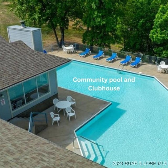 view of pool featuring a patio