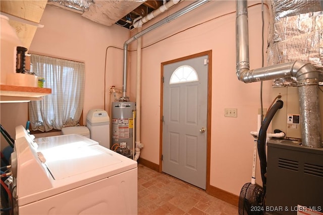 laundry room featuring gas water heater and washer and clothes dryer