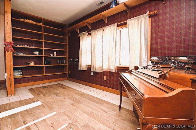 26 Gap Rd, Tunas, MO 65764 - miscellaneous room featuring wallpapered walls, wood finished floors, and baseboards