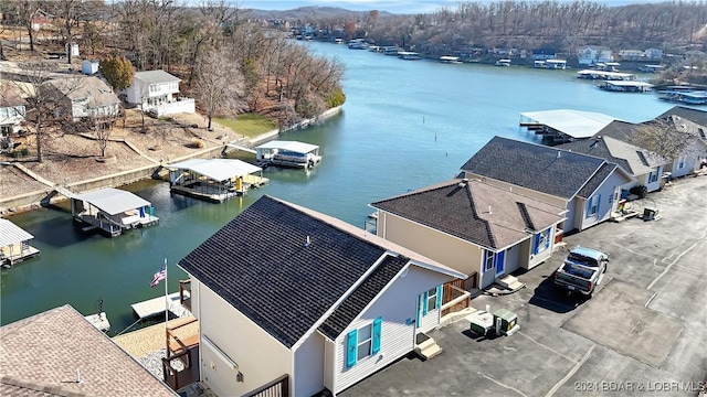 birds eye view of property featuring a water view