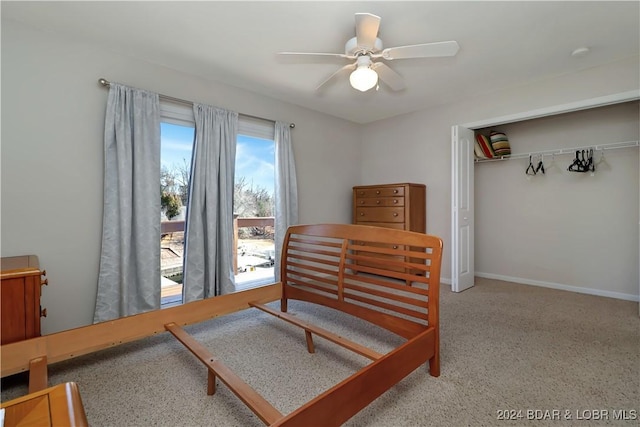 bedroom with ceiling fan and a closet