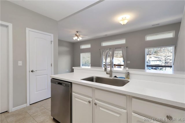 kitchen featuring white cabinetry, dishwasher, ceiling fan, sink, and light tile patterned floors