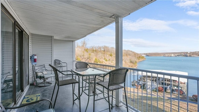 balcony featuring a water view