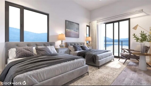 bedroom with access to exterior, light wood-type flooring, multiple windows, and a water and mountain view