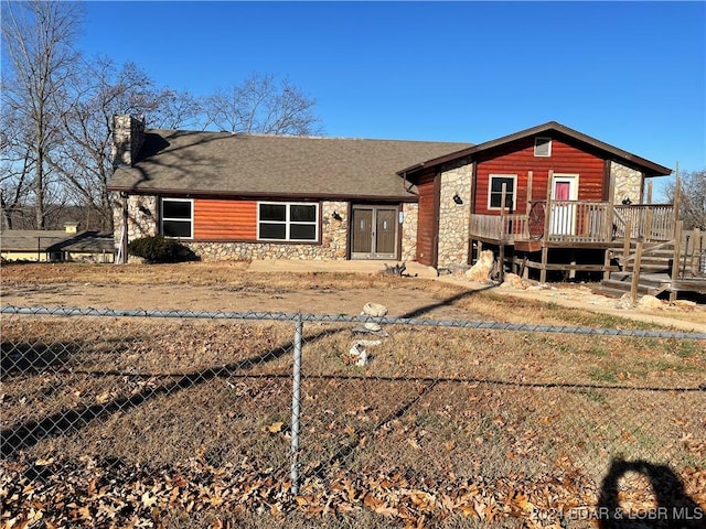 view of front of house featuring a wooden deck